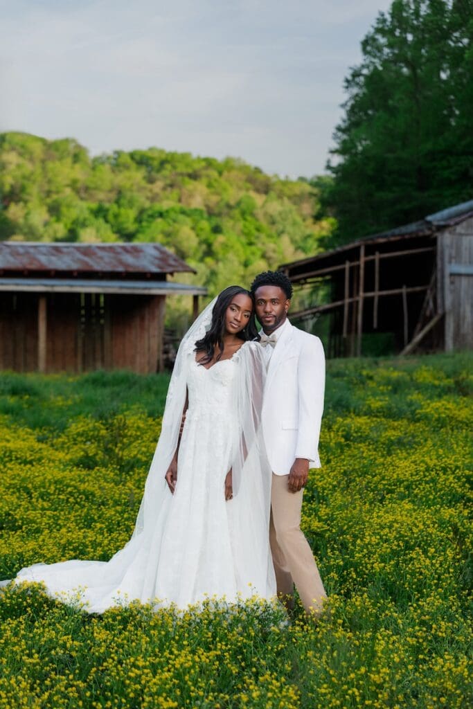 Bride and groom in yellow wildflower field