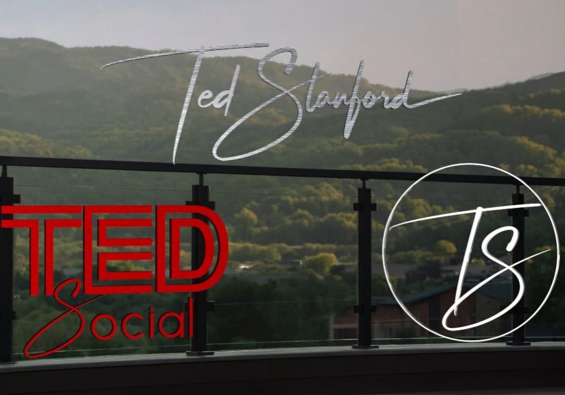 Glass balcony with TED Social logos, mountains
