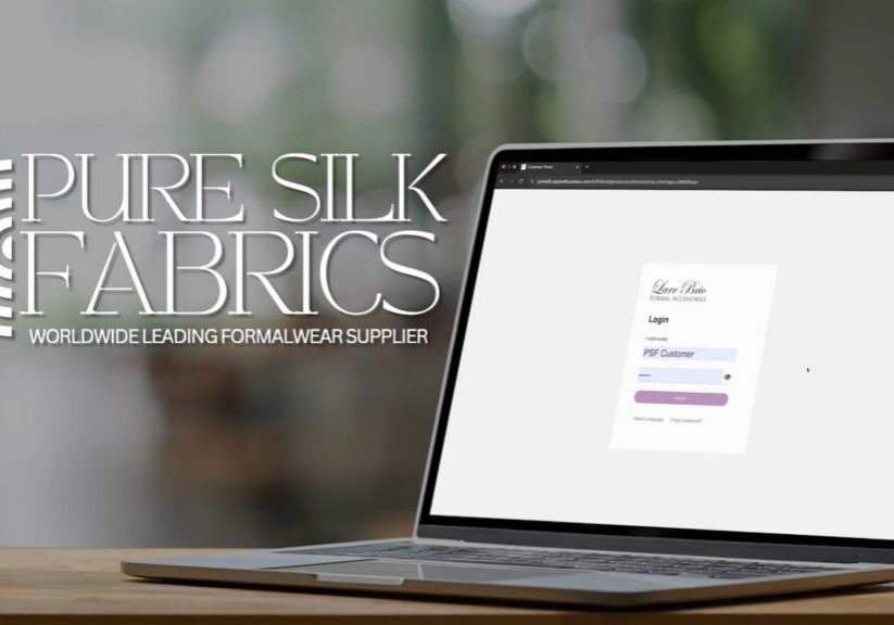 Laptop displaying Pure Silk Fabrics login screen