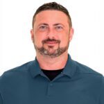 Smiling bearded man headshot on white background